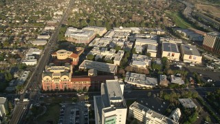 AX0017_103E - 5K aerial stock footage approach and orbit Walt Disney Company studios, Burbank, California