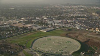 5K aerial stock footage of fly over residential neighborhoods to driving range, Sun Valley, California Aerial Stock Footage | AX0017_114