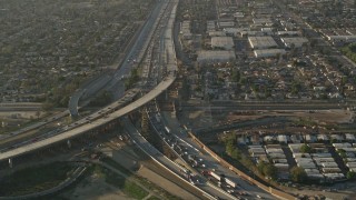 5K aerial stock footage of following interstates with heavy traffic, Sun Valley, California, sunset Aerial Stock Footage | AX0017_116