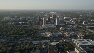 AX0018_013 - 5K aerial stock footage orbiting Downtown Orlando at sunrise in florida 