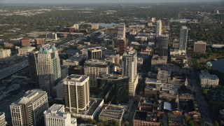 AX0018_019 - 5K aerial stock footage of office buildings in Downtown Orlando at sunrise in Florida