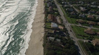 AX0018_083 - 5K aerial stock footage fly over beachfront homes in Melbourne Beach, Florida