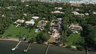 5K aerial stock footage of upscale homes beside the Indian River in Hobe Sound, Florida Aerial Stock Footage | AX0019_024