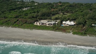 5K aerial stock footage of a pair of beachfront mansions in Hobe Sound, Florida Aerial Stock Footage | AX0019_028