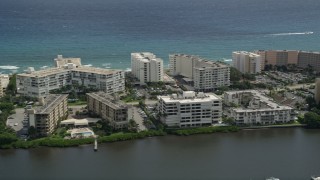 5K aerial stock footage flyby waterfront hotel and apartment buildings in Palm Beach, Florida Aerial Stock Footage | AX0019_076E