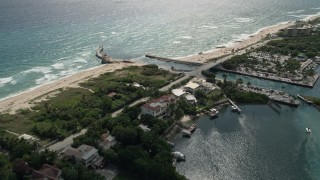 5K aerial stock footage pan from a mansion to reveal inlet and Boynton Beach, Florida Aerial Stock Footage | AX0019_083E