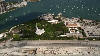 AX0020_033 - 5K aerial stock footage of Jungle Island Zoo near sailboats moored in the bay on Watson Island, Florida