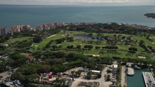 AX0020_041 - 5K aerial stock footage of an island golf course on Fisher Island, Florida