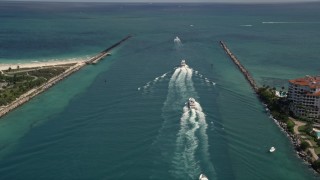 5K aerial stock footage approach a line of ferries sailing on Government Cut in Miami, Florida Aerial Stock Footage | AX0020_042