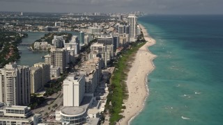 5K aerial stock footage fly over beachfront condominiums with ocean views in Miami Beach, Florida Aerial Stock Footage | AX0020_058