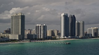 5K aerial stock footage of oceanfront high-rises along the beach in Sunny Isles Beach, Florida Aerial Stock Footage | AX0020_075E