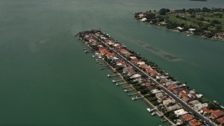 AX0020_099 - 5K aerial stock footage fly over island waterfront homes on Biscayne Point, Florida