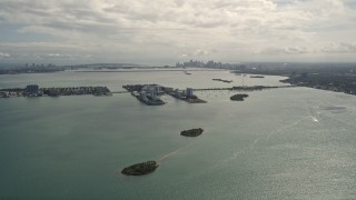 AX0020_101 - 5K aerial stock footage of small island with waterfront homes in Biscayne Bay, Florida