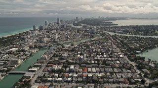 AX0021_017E - 5K aerial stock footage tilt from Surfside neighborhoods to reveal Biscayne Point and Miami Beach, Florida