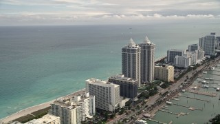 5K aerial stock footage of oceanfront hotels and condominiums in the coastal city of Miami Beach, Florida Aerial Stock Footage | AX0021_028E