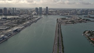 5K aerial stock footage tilt from MacArthur Causeway to reveal Downtown Miami skyscrapers in Florida Aerial Stock Footage | AX0021_076