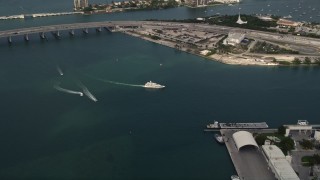 AX0021_094 - 5K aerial stock footage approach a yacht cruising the bay by Watson Island, Florida