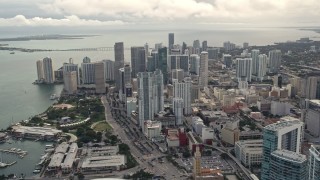 5K aerial stock footage pan from four skyscrapers to reveal and approach Downtown Miami high-rises, Florida Aerial Stock Footage | AX0021_096E