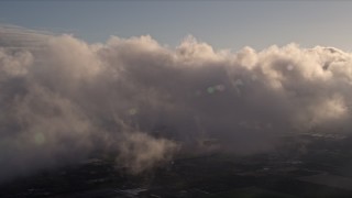 AX0022_002 - 5K aerial stock footage of a thick layer of clouds over Kendall at sunset in Florida