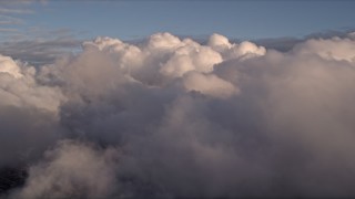 5K aerial stock footage approach thick cloud cover at sunset over Miami, Florida Aerial Stock Footage | AX0022_003