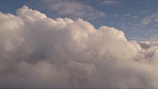 AX0022_012 - 5K aerial stock footage of passing cloud formation at sunset over Miami, Florida