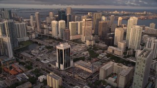 5K aerial stock footage approach skyscrapers in Downtown Miami at sunset, Florida Aerial Stock Footage | AX0022_028E