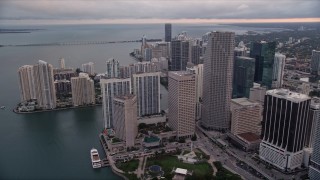 5K aerial stock footage of waterfront skyscrapers around Bayfront Park in Downtown Miami at sunset, Florida Aerial Stock Footage | AX0022_050E