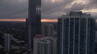 5K aerial stock footage flyby Four Seasons Hotel and Jade at Brickell Bay in Downtown Miami at sunset, Florida Aerial Stock Footage | AX0022_059