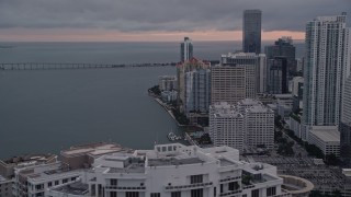 5K aerial stock footage flyby bayfront skyscrapers to reveal Icon Brickell in Downtown Miami at sunset, Florida Aerial Stock Footage | AX0022_066