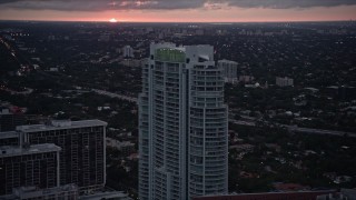 5K aerial stock footage approach the Santa Maria condo high-rise at sunset in Downtown Miami, Florida Aerial Stock Footage | AX0022_092