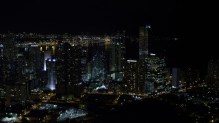 5K aerial stock footage of One Broadway and Four Seasons Hotel skyscrapers in Downtown Miami at night, Florida Aerial Stock Footage | AX0023_007