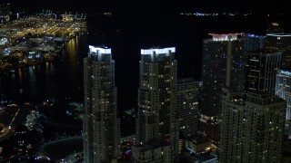 5K aerial stock footage orbit Vizcayne Towers at night in Downtown Miami, Florida Aerial Stock Footage | AX0023_023E