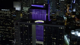 5K aerial stock footage of approaching 500 Brickell and Brickell World Plaza at night in Downtown Miami, Florida Aerial Stock Footage | AX0023_028E