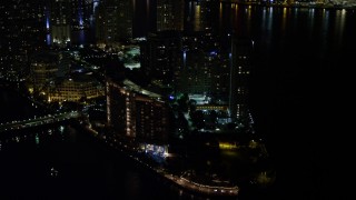 5K aerial stock footage approach Mandarin Oriental Hotel on Brickell Key in Downtown Miami at night, Florida Aerial Stock Footage | AX0023_036