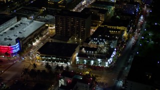 5K aerial stock footage of orbit small hotel and city streets at night in South Beach, Florida Aerial Stock Footage | AX0023_113