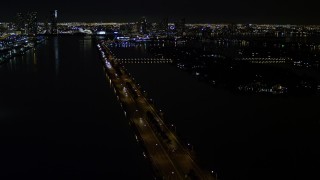 5K aerial stock footage of approaching the MacArthur Causeway with light traffic at night in Miami, Florida Aerial Stock Footage | AX0023_127E