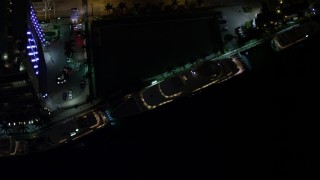 5K aerial stock footage bird's eye orbit of a yacht on the Miami River at night in Downtown Miami, Florida Aerial Stock Footage | AX0023_173E