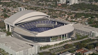 AX0024_029E - 5K aerial stock footage of flying by Marlins Park Stadium, Miami, Florida