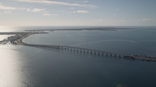 AX0024_047 - 5K aerial stock footage of flying by the Rickenbacker Causeway on Biscayne Bay, Florida