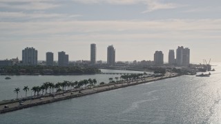 5K aerial stock footage of tracking traffic on MacArthur Causeway, reveal South Beach, Miami Beach, Florida Aerial Stock Footage | AX0024_068