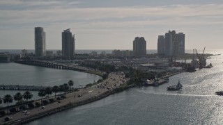 AX0024_069 - 5K aerial stock footage of following MacArthur Causeway, South Beach, Miami Beach, Florida