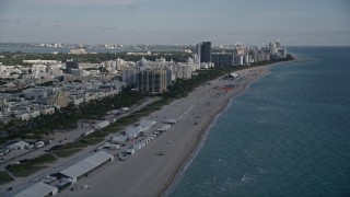 5K aerial stock footage of flying over the beach, approaching South Beach hotels, Miami Beach, Florida Aerial Stock Footage | AX0024_078E