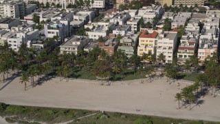 5K aerial stock footage of flying by palm trees at Lummus Park, South Beach, Miami Beach, Florida Aerial Stock Footage | AX0024_095