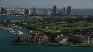 5K aerial stock footage of flying by Fisher Island Golf Course, Fisher Island, Florida Aerial Stock Footage | AX0024_100