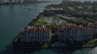 5K aerial stock footage of orbiting condominiums on the shore, Fisher Island, Florida Aerial Stock Footage | AX0024_101