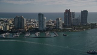 5K aerial stock footage of approaching Miami Beach Marina, skyscrapers in South Beach, Miami Beach, Florida Aerial Stock Footage | AX0024_102