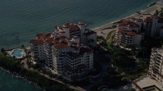 5K aerial stock footage of orbiting oceanfront condominiums, Fisher Island, Florida Aerial Stock Footage | AX0024_103