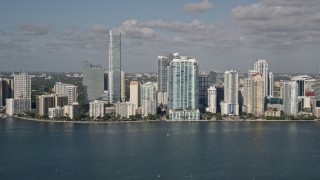 5K aerial stock footage of flying by Downtown Miami skyline, seen from Biscayne Bay, Florida Aerial Stock Footage | AX0024_119