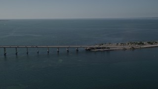 AX0024_120E - 5K aerial stock footage of light traffic crossing the Rickenbacker Causeway, Miami, Florida