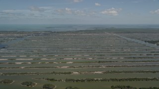 5K aerial stock footage of flying by Turkey Point Power Plant cooling canal system, Homestead, Florida Aerial Stock Footage | AX0025_027